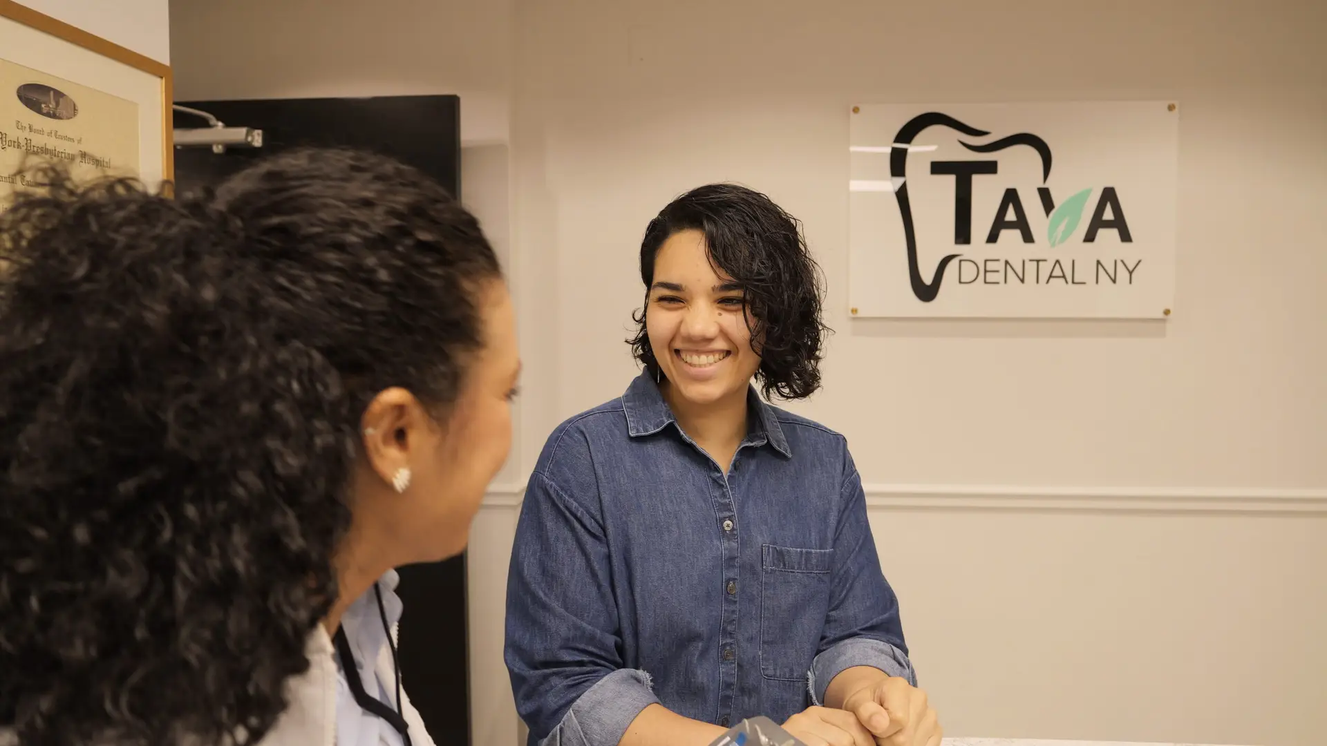 Tava Dental NY patient smiling after treatment